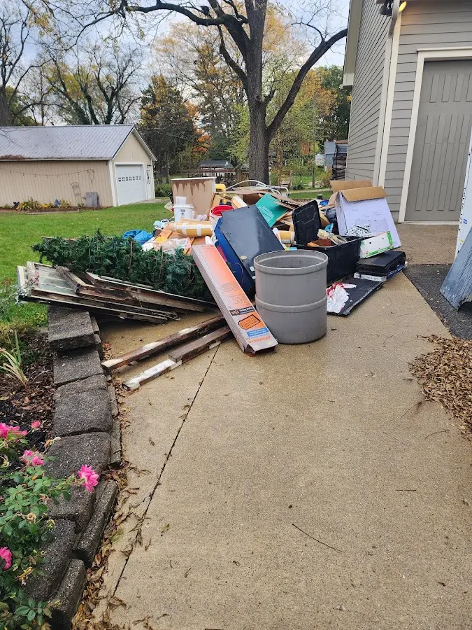 Dumpster being loaded with debris for Commercial Dumpster Rental in Central Park